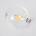 Λάμπα LED Long Filament E27 G125 Γλόμπος 7W 1470lm 360° AC 220-240V IP20 Φ12.5 x Υ13.8cm Θερμό Λευκό 2700K με Διάφανο Γυαλί - Pro Series 210lm/W - A Ενεργειακή Κλάση